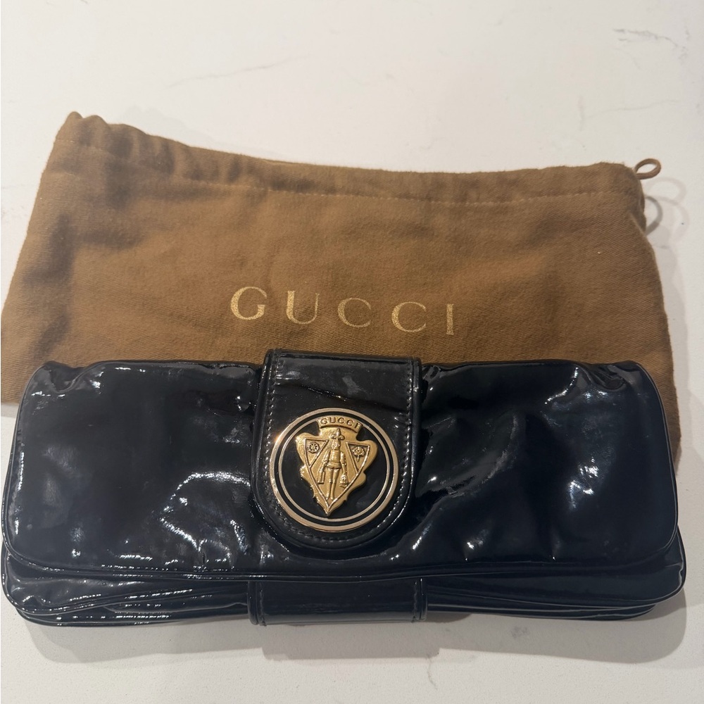 AUTHENTIC Gucci Black Patent Leather Clutch bag with Gold Emblem